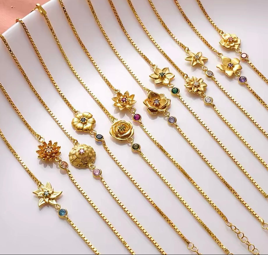 Geboortebloem met geboortesteentje armbandje goud